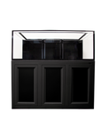 The Innovative Marine - INT 170 Gallon Complete Reef System is a modern, sleek black aquarium with a transparent glass tank on top and a storage cabinet with three paneled doors below, perfect for creating an impressive saltwater reef. It stands empty and isolated against a plain white background.