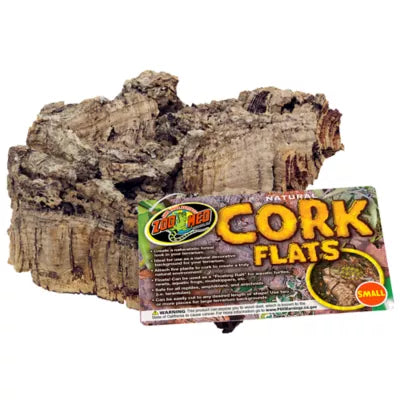 Displayed is a piece of natural cork bark, often used in reptile habitats for its rugged texture. The label reads Zoo Med - Cork Flat - Medium with product details.