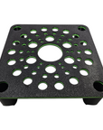 The AO - Skimmer Stand/Platform is a black, square stand with a textured surface and symmetrical circular perforations accented in green. It features four small legs, offering a modern and functional design.