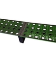 The Ao - Coral Frag Rack is a foldable, rectangular metal platform with circular cutouts on a green background. It features a clever dovetail design and sturdy legs, allowing daisy-chaining of multiple racks seamlessly.