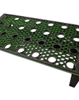 The Ao - Coral Frag Rack - Dovetail Linkable - Petg is a black and green perforated stand with circular holes in a grid, featuring a dovetail design. Its rectangular platform with two legs allows for daisy chaining multiple stands, enhancing flexibility and functionality.