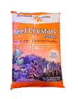 The Instant Ocean - Reef Crystals Reef Salt 50 Gal dry mix, featuring bright orange packaging with purple coral images, is ideal for reef aquariums. It is nitrate and phosphate-free, enriched with magnesium and calcium to promote optimal coral growth. Net weight: 14 lbs (6.35 kg).