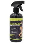 A black spray bottle labeled Komodo - Base Camp Glass and Surface Cleaner 16oz features a bird image. The label highlights its vinegar-based formula, emphasizing non-toxic cleaning properties.