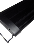 Close-up of the black, rectangular Aquarium Masters - Advance LED Lighting Systems 30 with a metal side handle, highlighting its sleek design and UL-listed adapter. Vent-like channels indicate airflow, ensuring safety. The plain white background enhances its modern look.