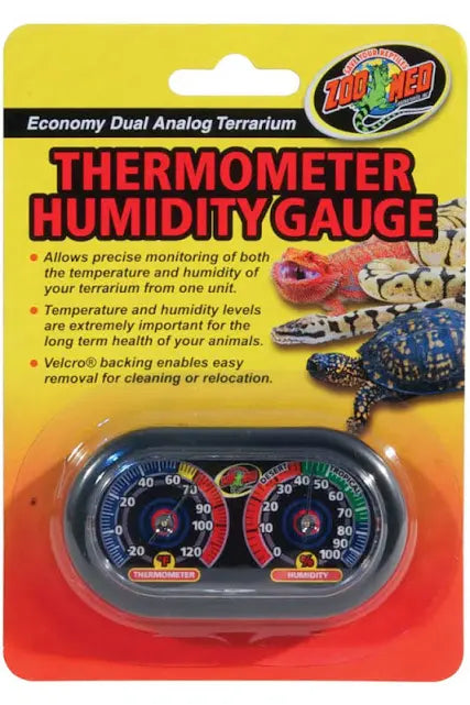 The Zoo Med - Thermometer Humidity Gauge packaging showcases reptile images and highlights features like temperature and humidity monitoring, with Velcro backing for easy placement.