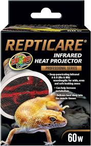 The image displays a ZooMed ReptiCare Infrared Heat Projector 60w bulb, part of the professional series for reptiles. The packaging shows a lizard and emphasizes benefits such as enhanced metabolism and penetration deep into muscle tissues.