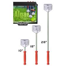 The Flipper Platinum Aquarium Scraper 18 is one of three cleaning brushes with red handles and white scrubbing heads (lengths: 10, 18, 28). An image shows the brush removing algae from an aquarium wall, with text reading Algae and Platinum.