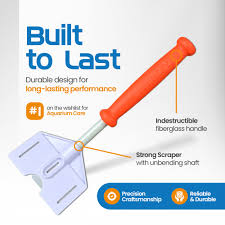 An image of the Flipper - Platinum Aquarium Scraper 18 showcases its orange handle and white head. Features include Built to Last, with an Indestructible fiberglass handle, a Strong Scraper with unbending shaft, plus Precision Craftsmanship, ensuring its Reliable & Durable.