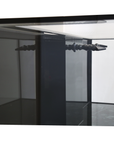 Interior view of the Innovative Marine - INT 170 Aquarium w/ APS Stand featuring a black vertical column and two horizontal rods. Its reflective surface highlights a sleek design with an internal overflow, ideal for displaying its spacious 170-gallon capacity.