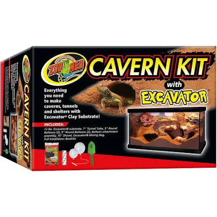 An image features the Zoo Med - Cavern Kit W/ Excavator Clay box, displaying a terrarium setup with tools for crafting caverns, tunnels, and shelters using clay substrate. The front showcases vivid images of reptiles and product elements.