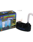 The Zoo Med - Repti Fogger Terrarium Humidifier is an ultrasonic device with a sleek black base, transparent water container, and flexible white tube. Its vibrant packaging features tropical graphics and the product image.