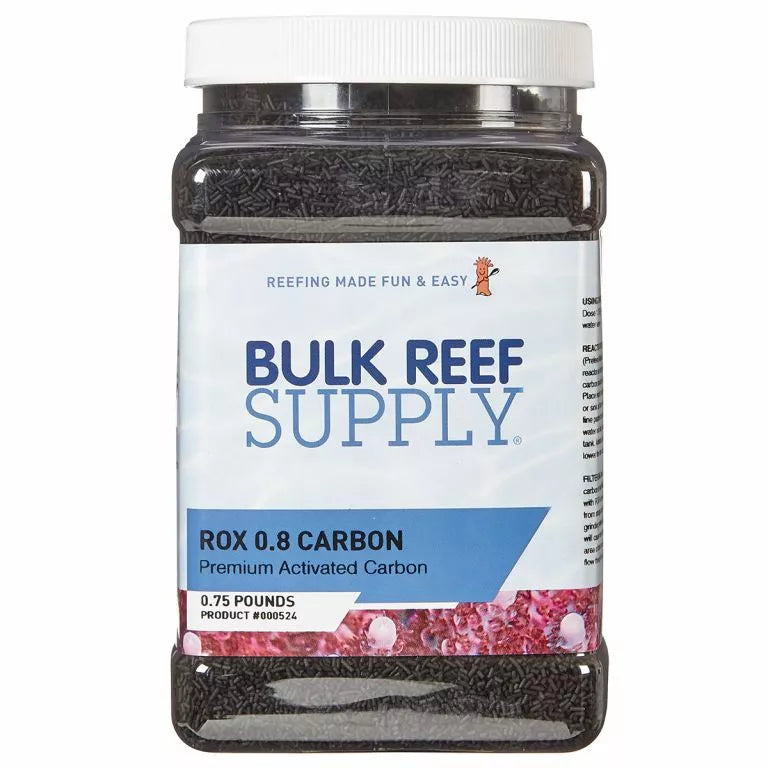 The image displays a container labeled Bulk Reef Supply - Bulk Premium ROX 0.8 Aquarium Carbon .75 lbs, perfect for aquarium filtration. Weighing 0.75 pounds, it fits well in media reactors and features pink coral with blue text on a white background.