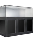 A large, pristine Innovative Marine- EXT 200 Aquarium with an APS Stand sits atop a sleek black wooden cabinet with three panel doors. The empty and clean aquarium matches the cabinets spacious storage in both style and functionality.