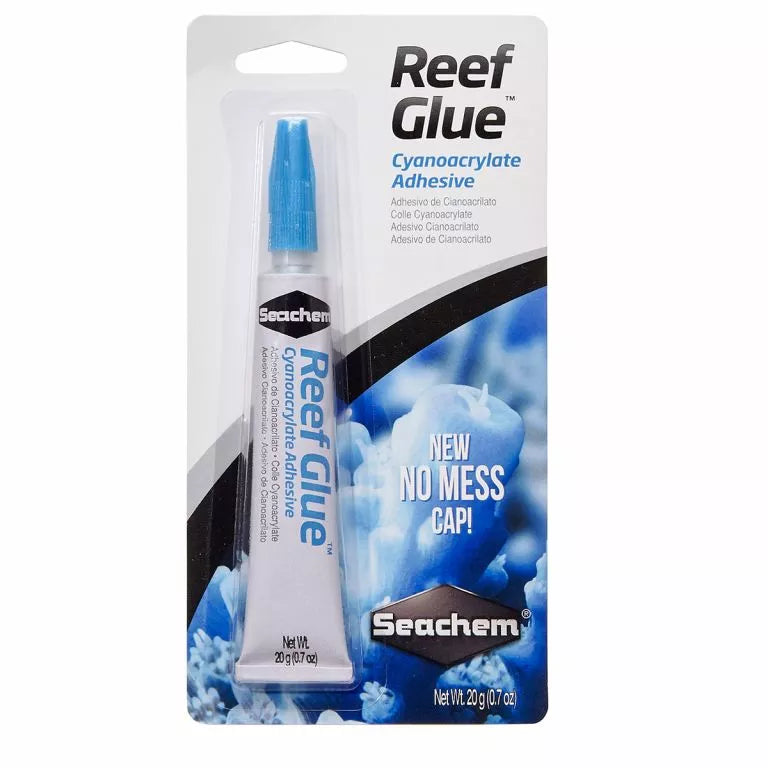 The Seachem - Reef Glue (20g/0.7oz) comes in a clear tube with a blue cap, labeled Cynoacrylate Adhesive. It features a New NO MESS CAP! and is ideal for aquascaping projects and coral frags, with packaging showcasing vibrant coral images.