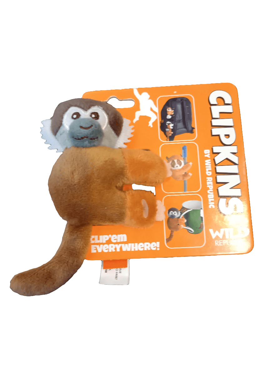 A 3" Clipkin plush toy featuring a monkey design with a blue face and brown body, attached to vibrant orange packaging labeled with the brand names CLIPKINS and Wild Republic. The package displays images of the toy clipped onto different objects, accompanied by the phrase "Clip em everywhere!