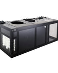 This image showcases the Innovative Marine -INT 200 Gallon Complete Reef System, a rectangular black aquarium sump with transparent panels. It is designed for optimal saltwater management, featuring multiple filtration chambers with white filter media and control knobs for efficient water purification.