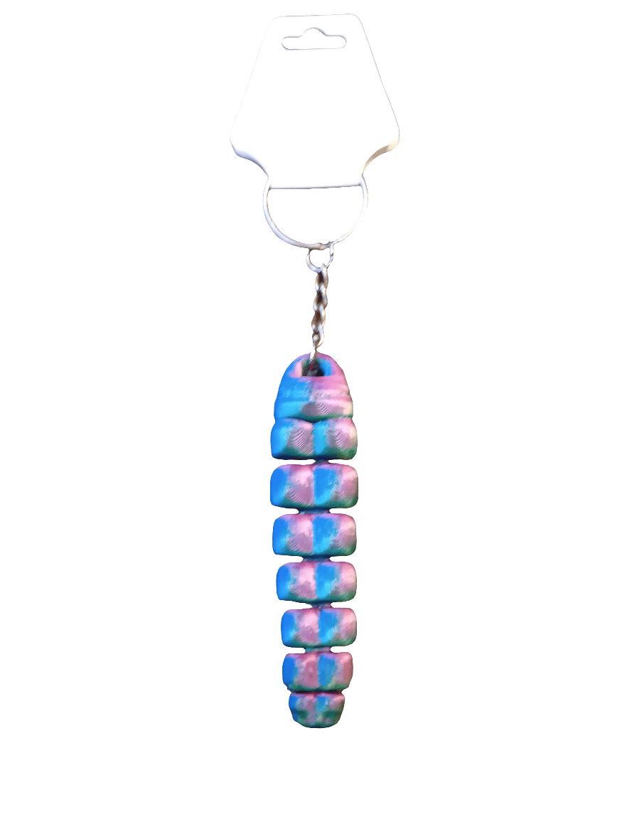 A vibrant 3D Print KeyChain/Magnet featuring stacked, rounded segments in blue, pink, and white polymer clay, complemented by a metal chain and a transparent plastic clasp.