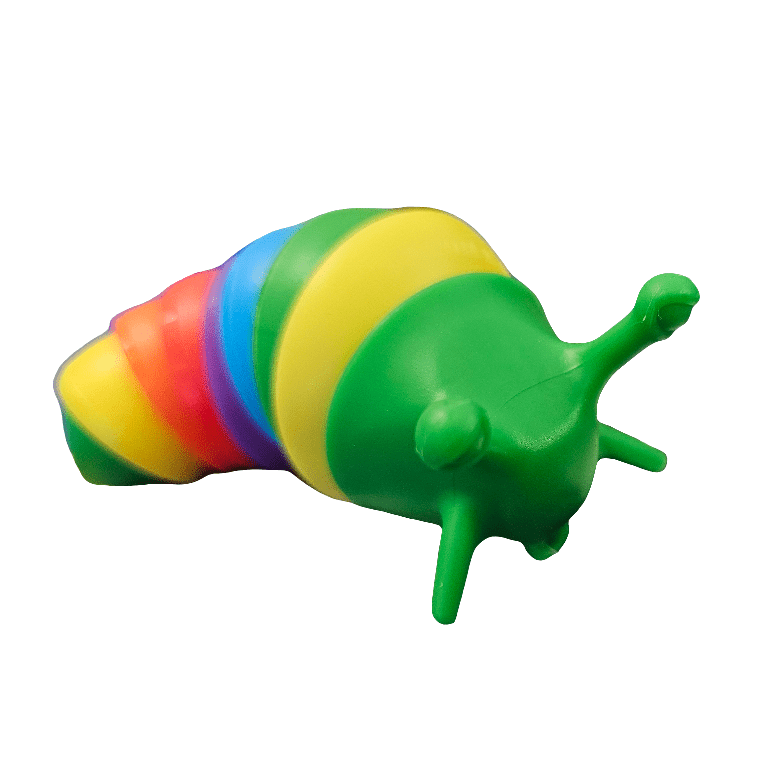 The 4" Rainbow Slugpillar features a vibrant rainbow-striped shell in the shape of a snail and a bright green body with cartoon-like features. The toy is set against a plain white background.