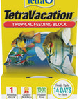 The Tetra - TetraVacation Tropical Feeding Blocks come in yellow packaging with aquarium fish images. Features include Feeds Up to 14 Days Per Block, Quality Nutrition, and 100% Plaster Free. The packaging includes the Tetra logo and a net weight of 1.06 oz (30g).