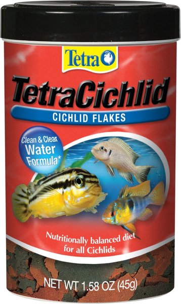 A 1.58 oz (45g) container of TetraCichlid Cichlid Flakes features three fish images and a front label showcasing Clean & Clear Water Formula while stating it provides a Nutritionally balanced diet for all Cichlids.