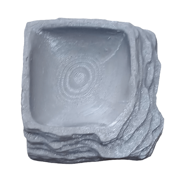 Introducing the AO - Reptibowl Mini, a textured stone bowl with a unique square shape and intricate concentric circle designs inside. Its irregular, layered edges mimic natural rock formations, and it features a light gray color.