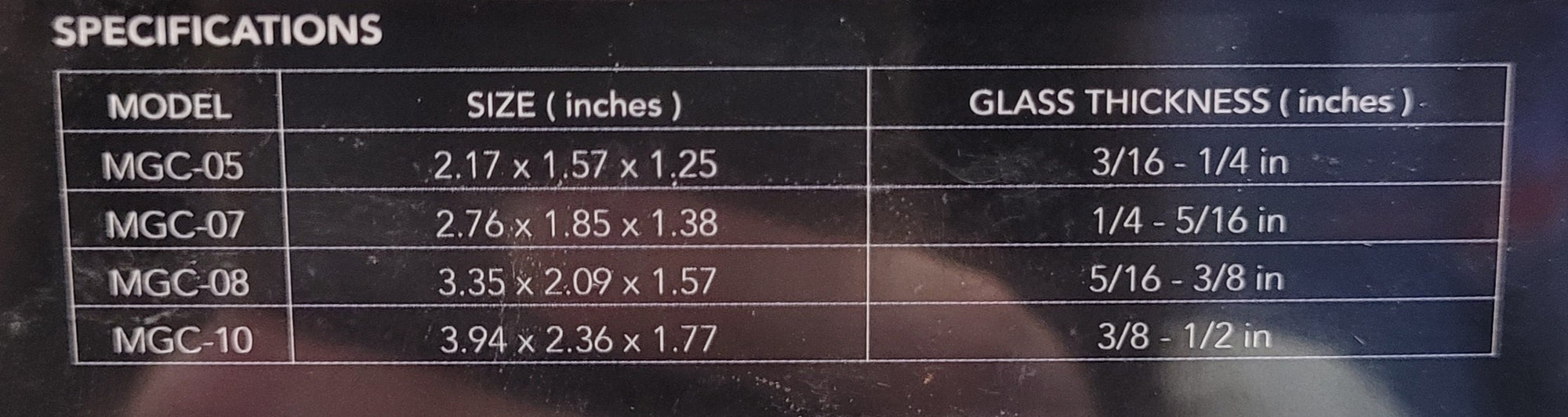 A close-up image features a specifications table for the Aquatop Forza Magnetic Glass Cleaner - Extra Small, highlighting model numbers MGC-05, MGC-07, MGC-08, and MGC-10. The table includes their respective dimensions and glass thickness in inches ranging from 2.17 x 1.57 x 1.25 to 3.94 x 2.36 x 1.77 inches with a thickness from 3/16 - 1/4 inch to 3/8 - 1/2 inch.
