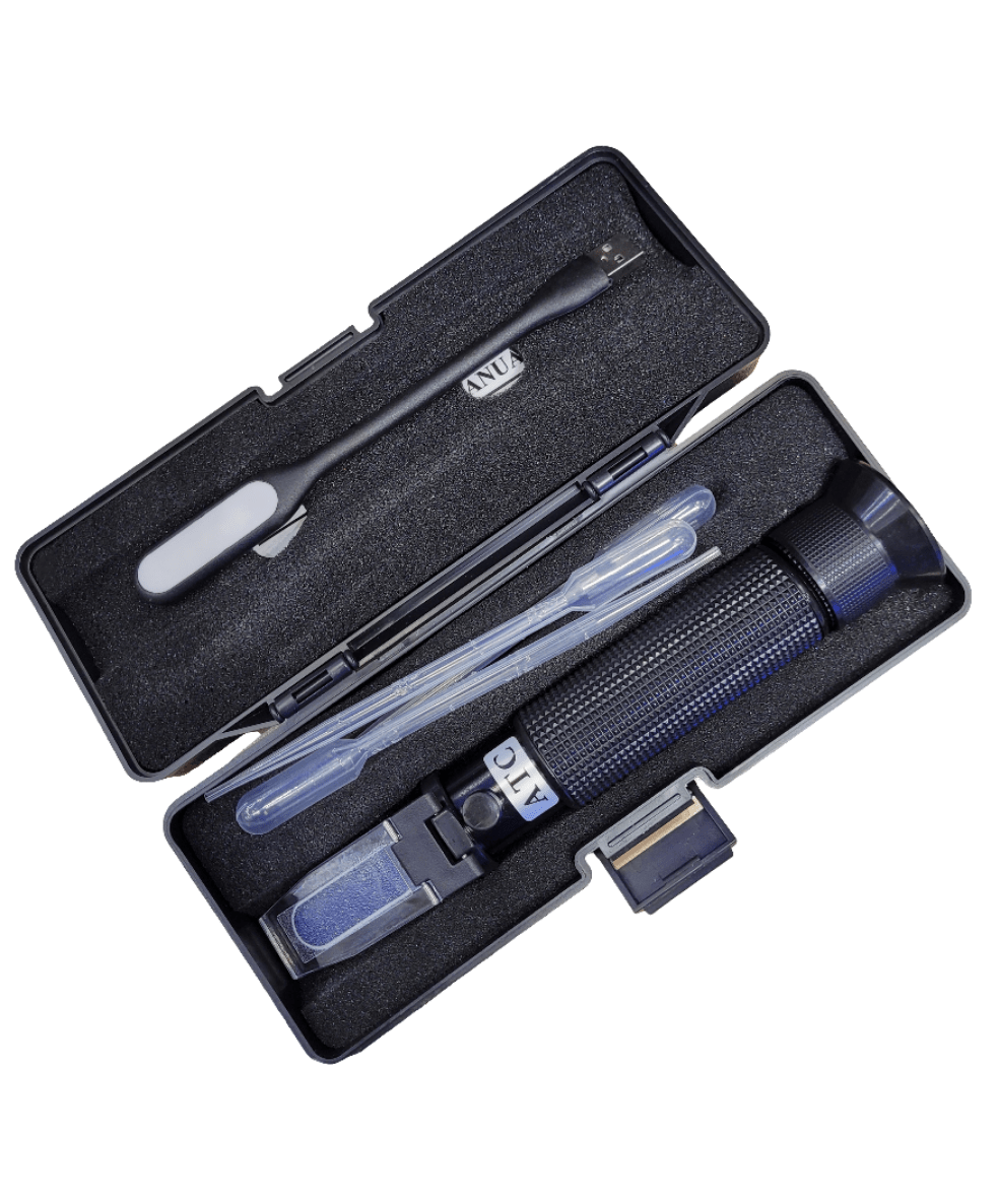 The Basic Refractometer set, featuring a black portable refractometer, is housed in a foam-padded case and comes with a small screwdriver, a plastic dropper, and a cleaning cloth.