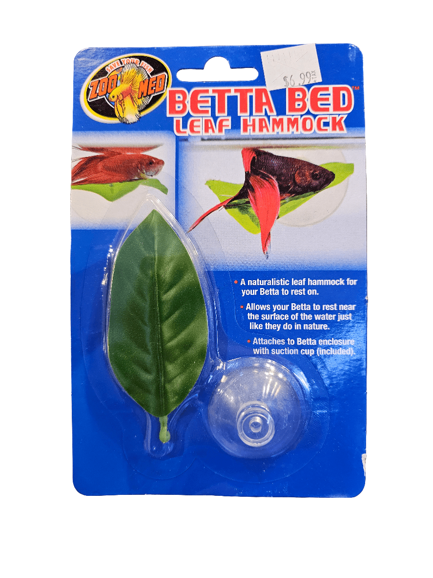 Packaging for the Zoo Med Betta Bed Leaf Hammock showcases a lifelike leaf hammock equipped with a suction cup. The packaging displays images of a red Betta fish utilizing the leaf close to the water's surface. It is priced at $6.99.