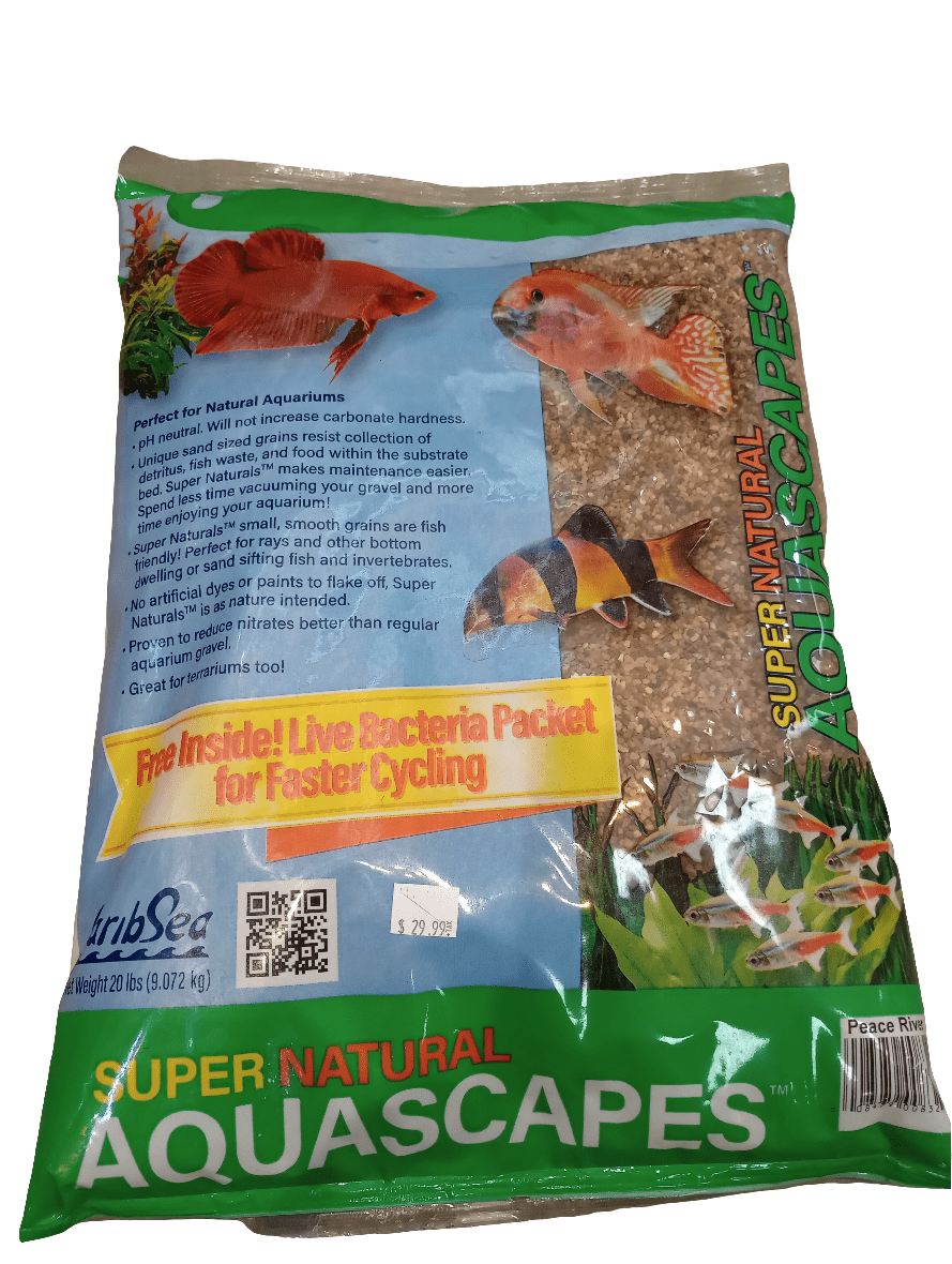 A 20 lbs bag of aquarium substrate labeled as CaribSea - Aquascapes - Super Natural - Peace River, featuring images of fish and aquatic plants and promoting a free live bacteria packet.