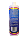 A cylindrical bottle of CaribSea - Purple Up - Coralline Algae Accelerator 473ml features a white cap and a vibrant label adorned with Coraline algae patterns. The label is densely packed with small text providing instructions and product details, while the base of the bottle showcases a barcode.