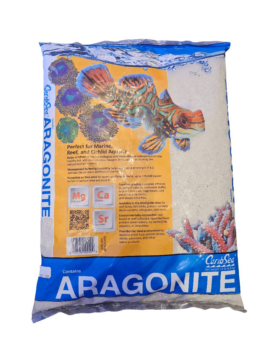 The CaribSea - Special Grade Reef Sand - Aragonite 15 Lb is designed for marine, reef, and cichlid aquariums. The packaging showcases vibrant images of marine life and emphasizes essential minerals such as magnesium, calcium, and strontium, with the CaribSea brand clearly displayed.