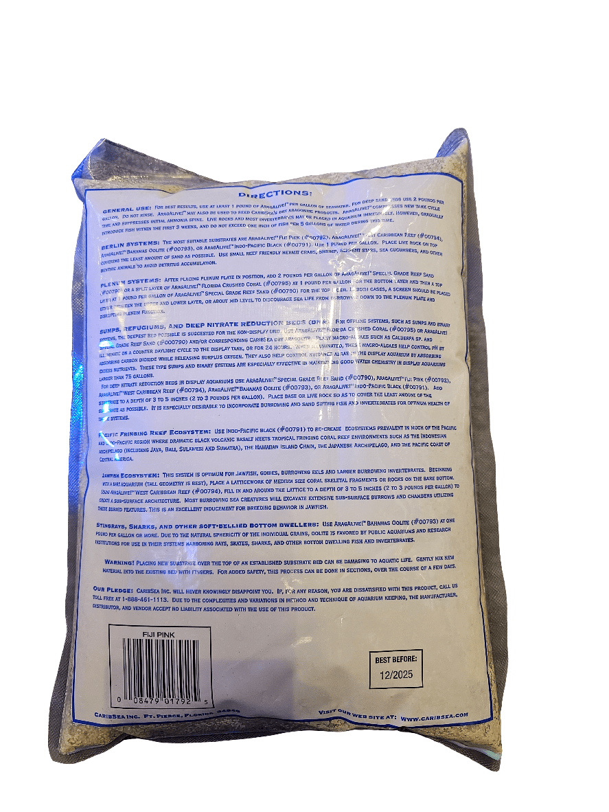 A rectangular package features text on the back providing directions and product information about Caribsea - Arag Alive - Fiji Pink 10 lbs. The packaging underscores its natural composition, similar to marine bacteria found in aragonite reef sand. A Best Before date of 12/2025 is stamped at the bottom.