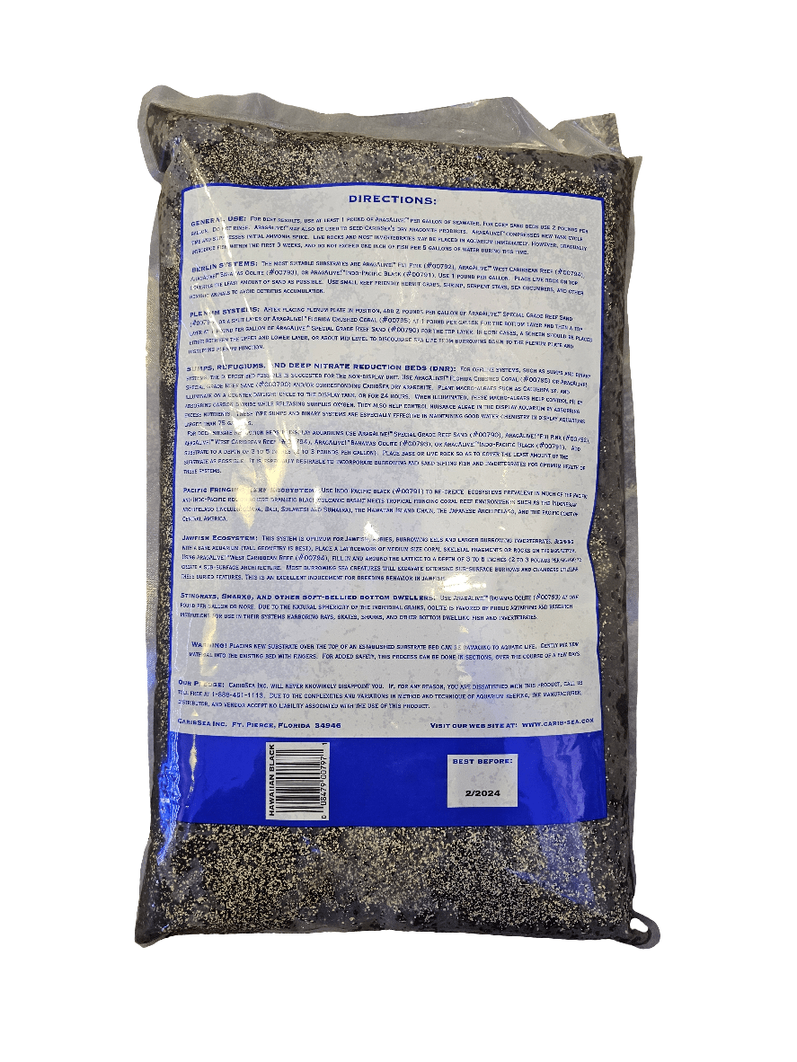 A package of Caribsea - Arag Alive - Hawaiian Black 20 Lbs with clear nutritional information and usage instructions in blue text on the back. The bag is transparent, revealing small, dark seeds that resemble marine bacteria in pristine waters. The best before date is labeled at the bottom.