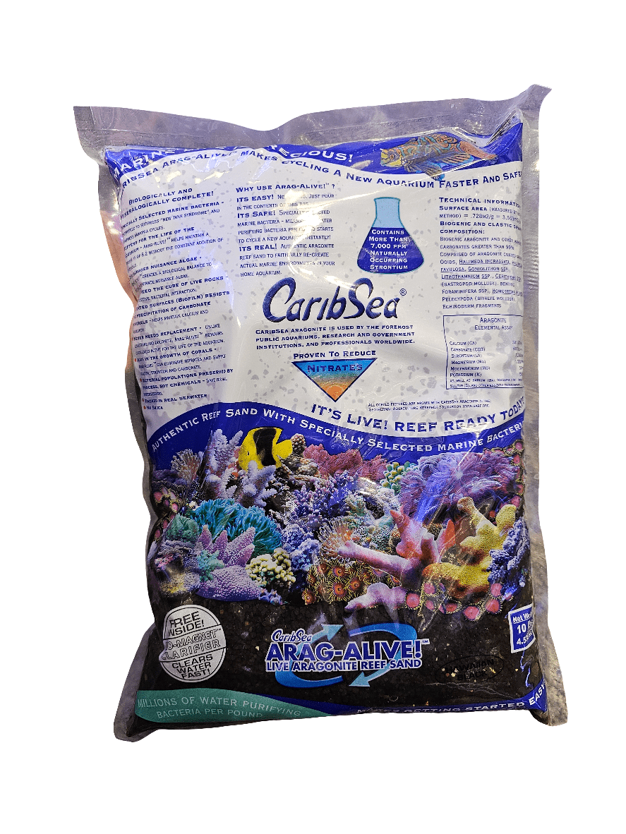 A bag of Caribsea - Arag Alive Sand - Hawaiian Black 10 lbs. The packaging features vibrant images of coral reefs and fish and claims to reduce nitrates while promoting a balanced ecosystem for marine aquariums.