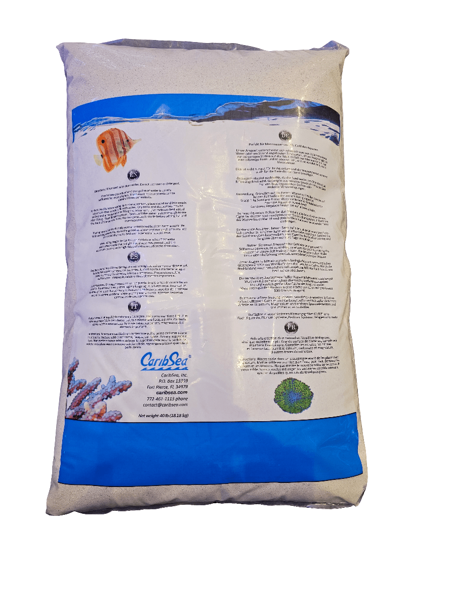 A bag of Caribsea - Aragonite Dry Sand - Fiji Pink 40lb with detailed instructions and warnings, showcasing small images of coral and healthy fish on the packaging, set against a white background.