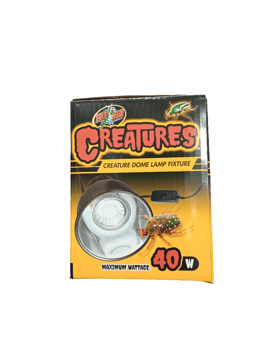 The Creatures Dome Lamp Fixture by Box of Creatures has a maximum wattage of 40W. The packaging showcases an image of the lamp along with a colorful frog graphic and vibrant yellow and black colors.