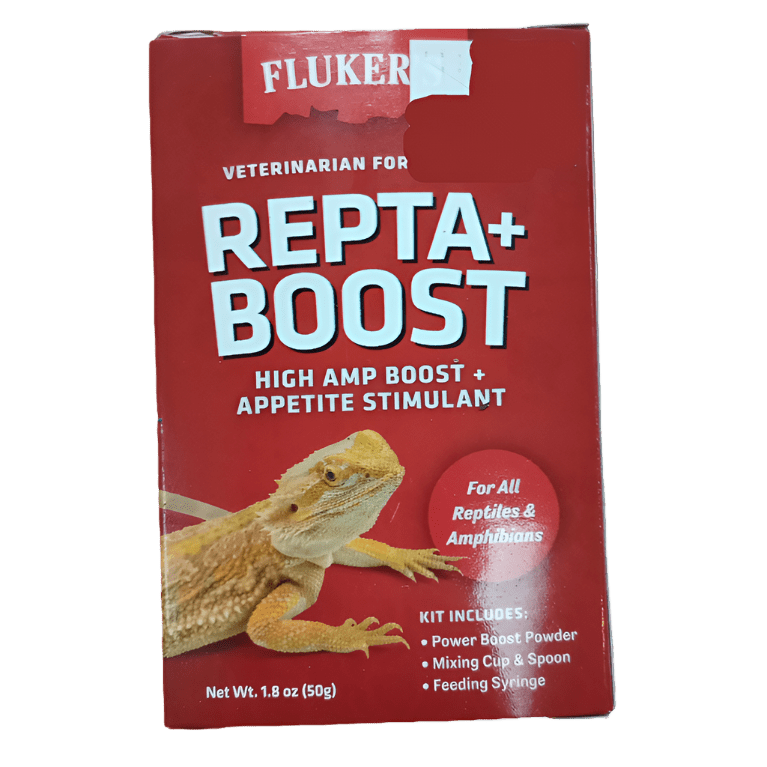 Fluker's - Repta+Boost 50g comes in red packaging and is designed as a high-amp boost and appetite stimulant for reptiles and amphibians. The product includes power boost powder, a mixing cup, a spoon, and a feeding syringe. The packaging features an image of a lizard, with the net weight being 1.8 oz (50g).