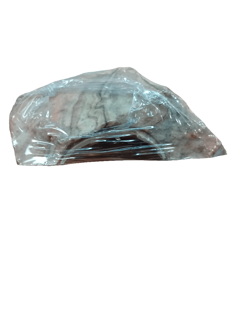 A 6" Flukers Cave is wrapped in transparent plastic, highlighting its detailed design. The product is showcased against a plain white background.