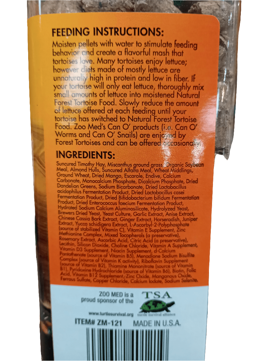 A close-up of the Forest Tortoise Food 15oz Zoo Med package offers feeding instructions for forest tortoise species, detailing how to hydrate the food and transition them from lettuce to this packaged meal. Ingredients such as Timothy Hay, soybeans, alfalfa, and a range of vitamins provide essential nutrition for Red-foot tortoises.