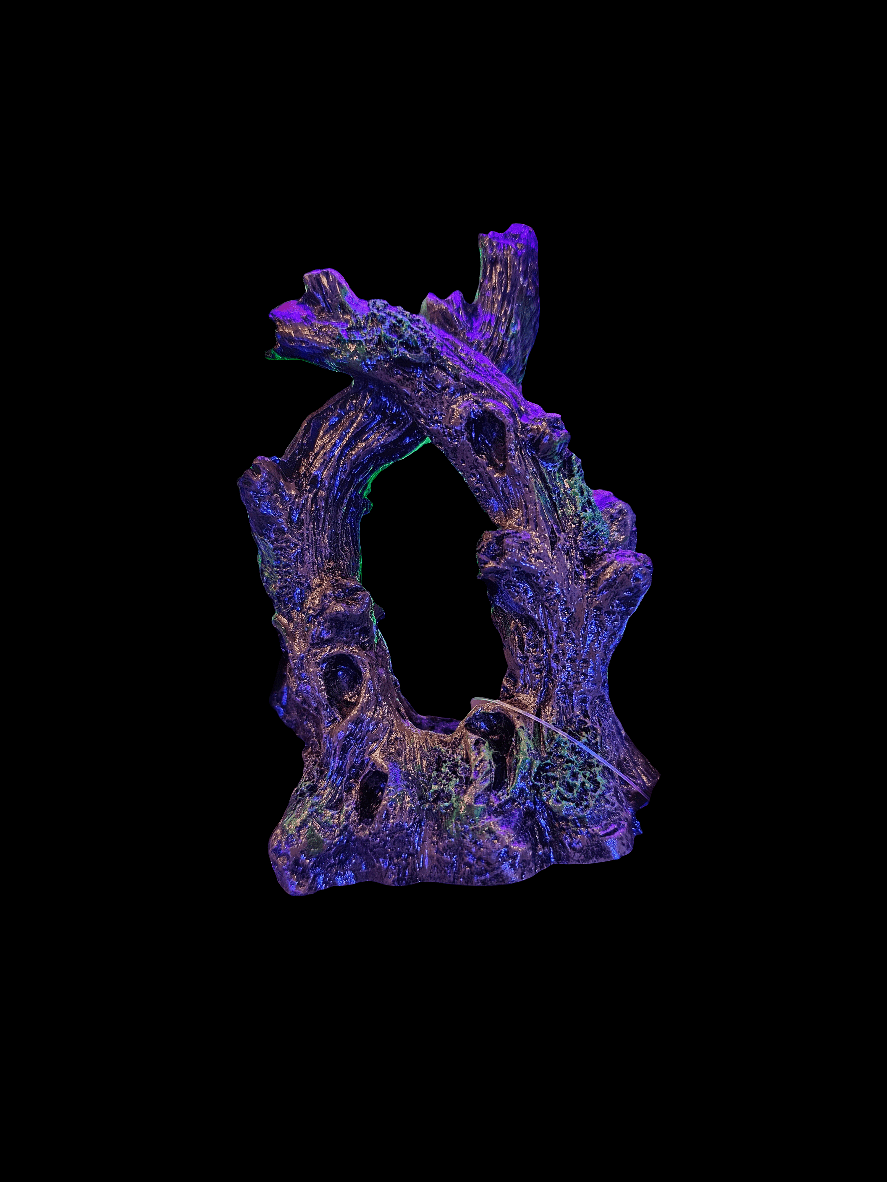 A GloFish - Ornament Twisted Tree, featuring intertwined, textured branches with circular openings. The surface glows with shades of purple and subtle green highlights against a black backdrop, capturing the vibrant charm reminiscent of Fluoresses.