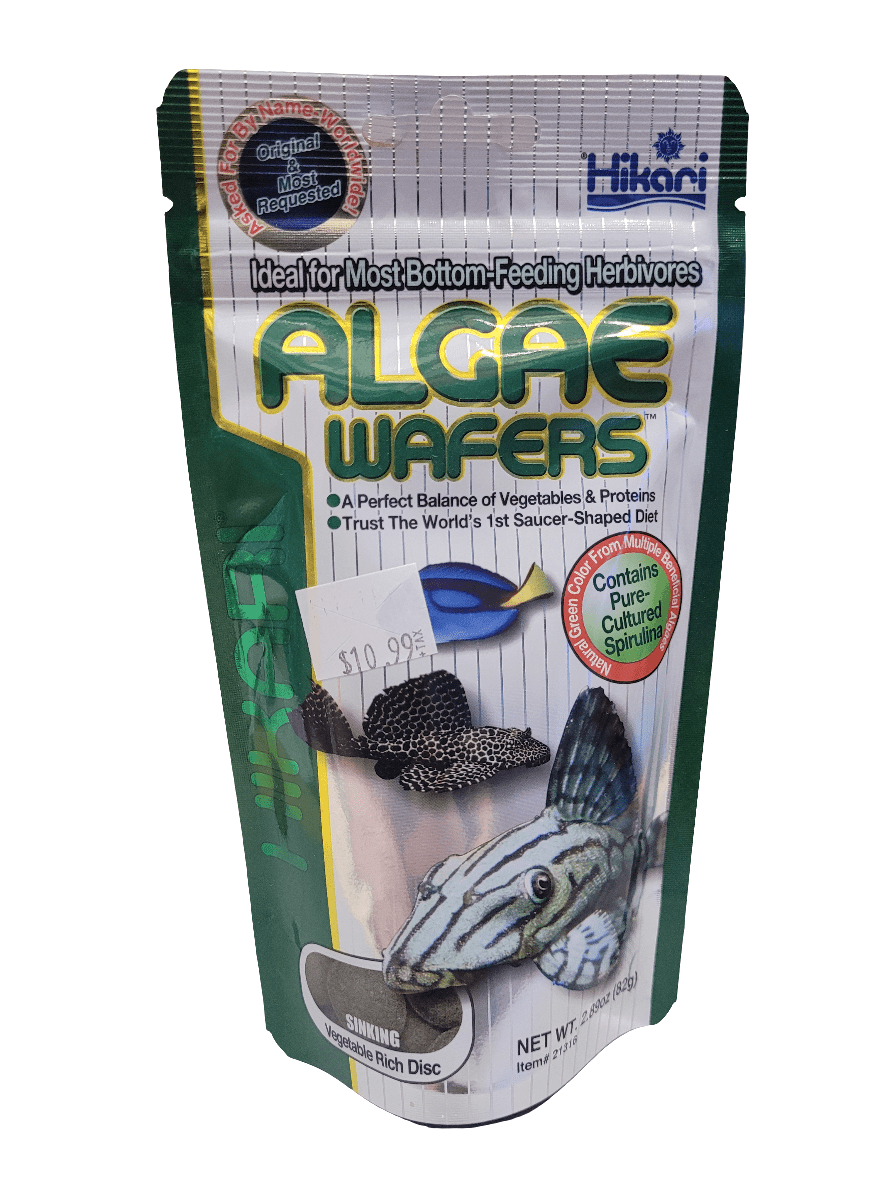 A package of Hikari Algae Wafers (2.89oz) featuring a fish image claims it is ideal for bottom-feeding herbivores and contains pre-cultured spirulina, priced at $10.99.