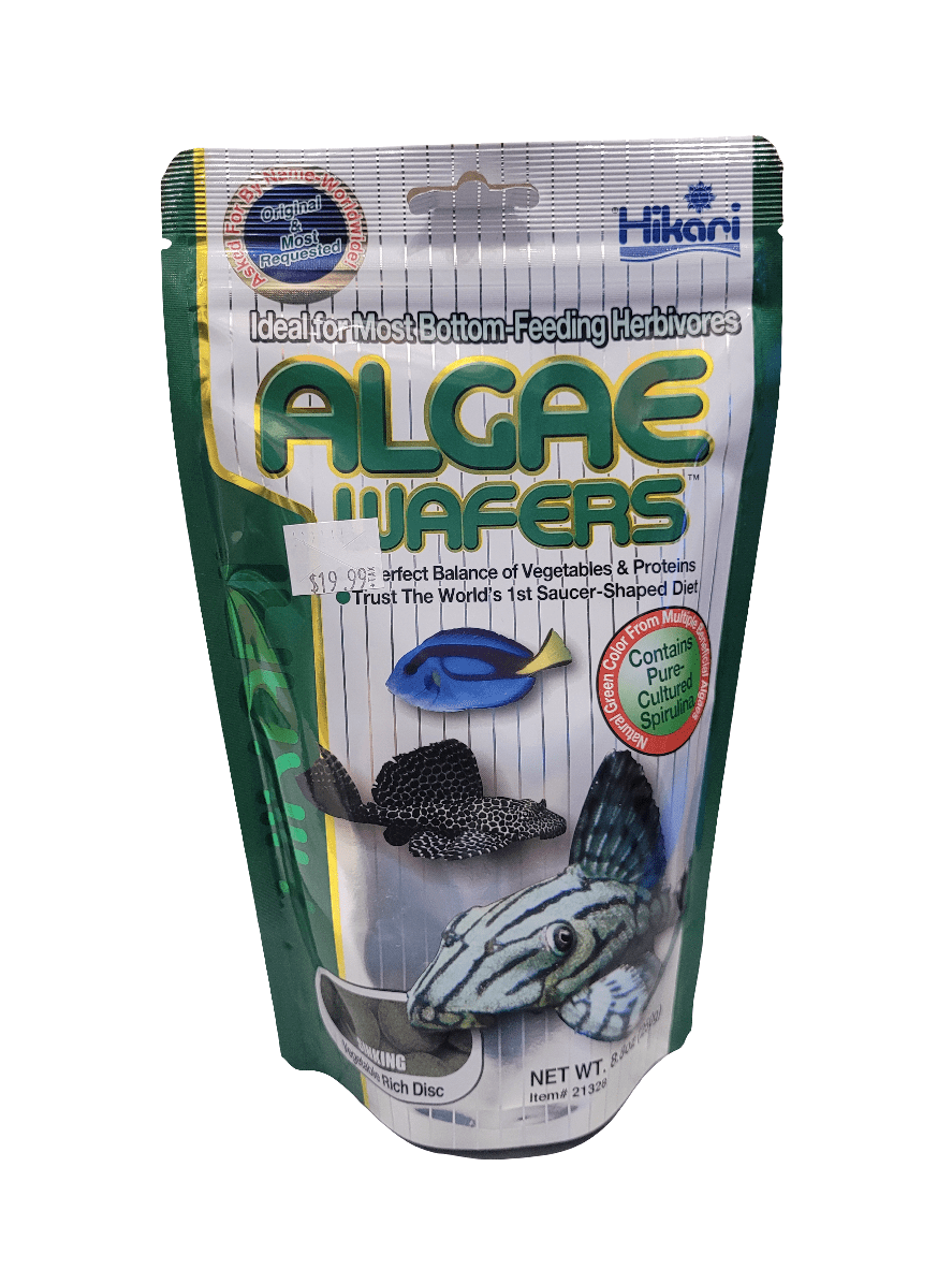 A package of Hikari - Algae Wafers - 8.8oz fish food. The packaging is green and white, showcasing images of fish along with the product name. It emphasizes that the wafers are perfect for bottom-feeding herbivores and include pure-cultured spirulina.