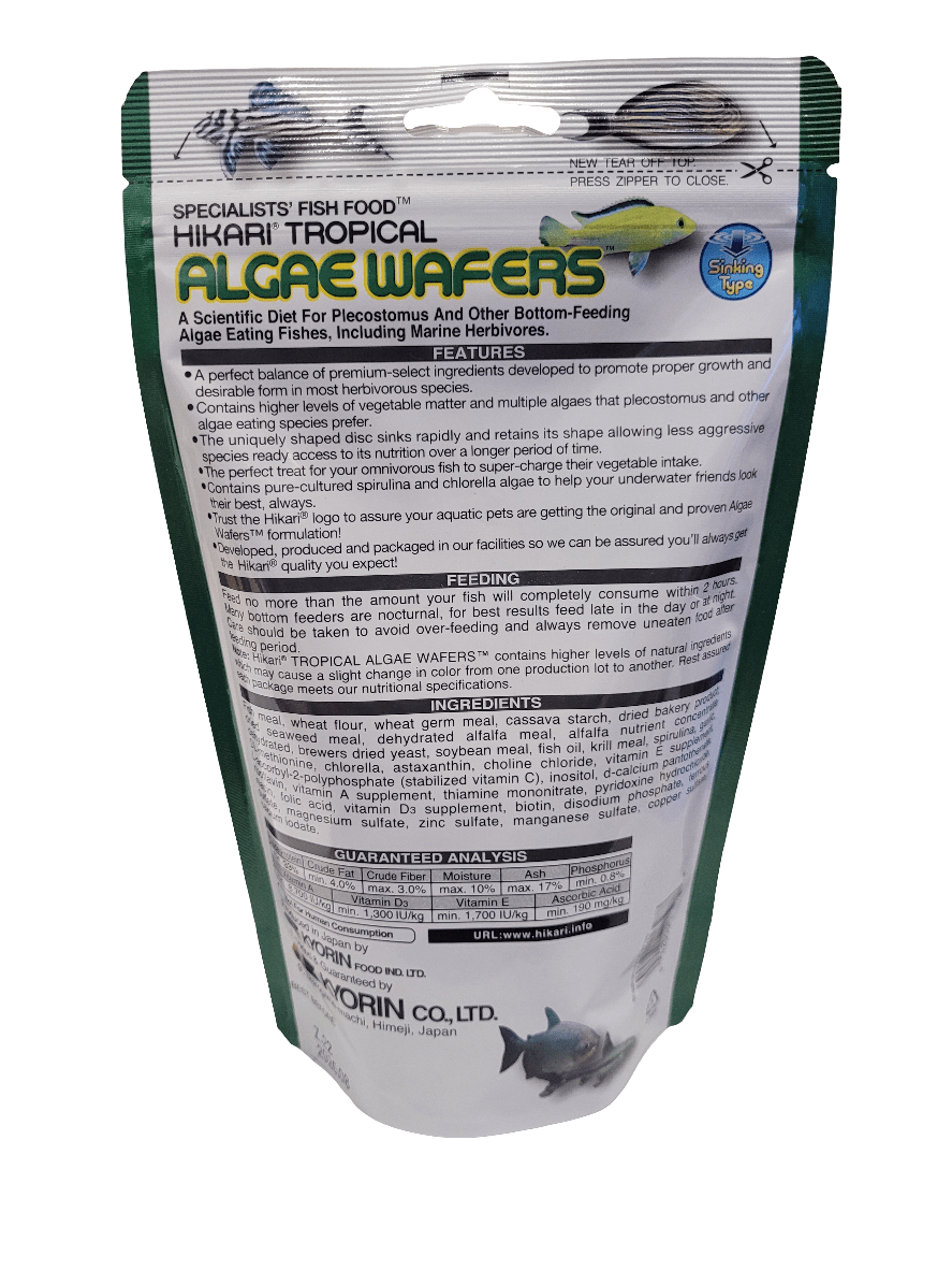 The packaging of Hikari - Algae Wafers - 8.8oz, specifically crafted for plecostomus and algae-eating fish, prominently features product details and feeding instructions on the front, along with an illustration of a blue fish at the bottom.