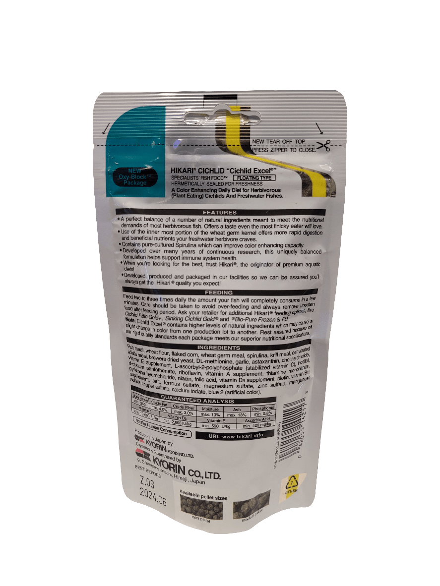 A standing package of Hikari - Cichlid Excel - Mini Floating 2.01oz fish food featuring detailed printed information in English, including a product description, features, feeding instructions, and company details. The packaging is primarily white with colored accents.