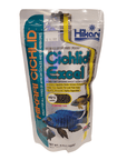 A package of Hikari - Cichlid Excel - Mini Floating fish food features images of vibrant fish on the front, along with text emphasizing its benefits for herbivorous and omnivorous cichlids. It contains wheat germ and spirulina and has a net weight of 8.8 oz (250 g).