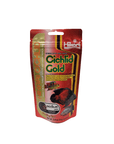 A 2.01 oz package of Hikari Cichlid Gold Medium Floating fish food in red and yellow, showcasing a vibrant fish image and highlighting its color-enhancing properties.