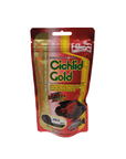 A red and yellow package of Hikari Cichlid Gold fish food showcases advantages for cichlids and other tropical fish. It includes mini pellets and emphasizes color enhancement, containing 2.01 oz of food.