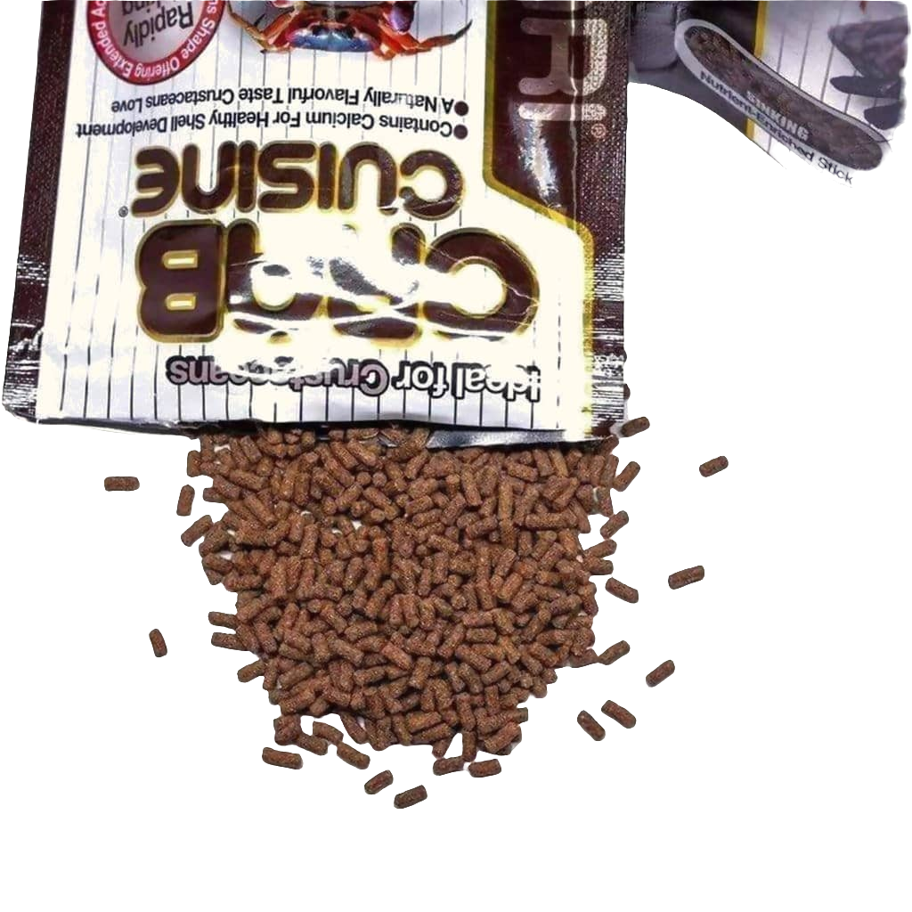 Open packet of Hikari - Crab Cuisine - Sinking - 1.76oz with brown pellet-style dry food spilling out, showing some text and a partial logo on the packet.