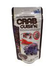 The Hikari Crab Cuisine package, featuring images of crabs, promotes healthy shell development with its rapidly sinking sticks and comes in a net weight of 1.76 oz (50g).