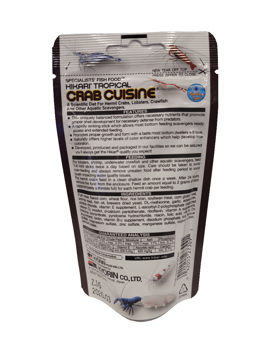 A 1.76 oz bag of Hikari Crab Cuisine Sinking fish food suitable for hermit crabs, lobsters, and crayfish features a silver package adorned with black and red text providing nutritional information and product details, along with illustrations of crabs and crawfish.